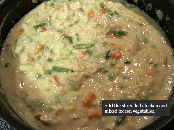 Add the shredded chicken and mixed frozen vegetables for the chicken pot pie from Walking on Sunshine Recipes