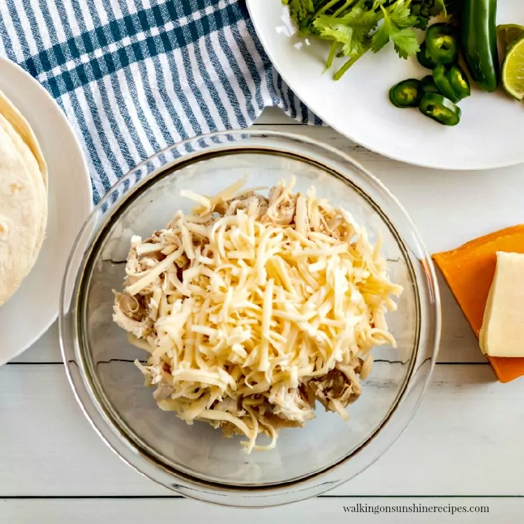 Combine chicken and cheese together in bowl. 