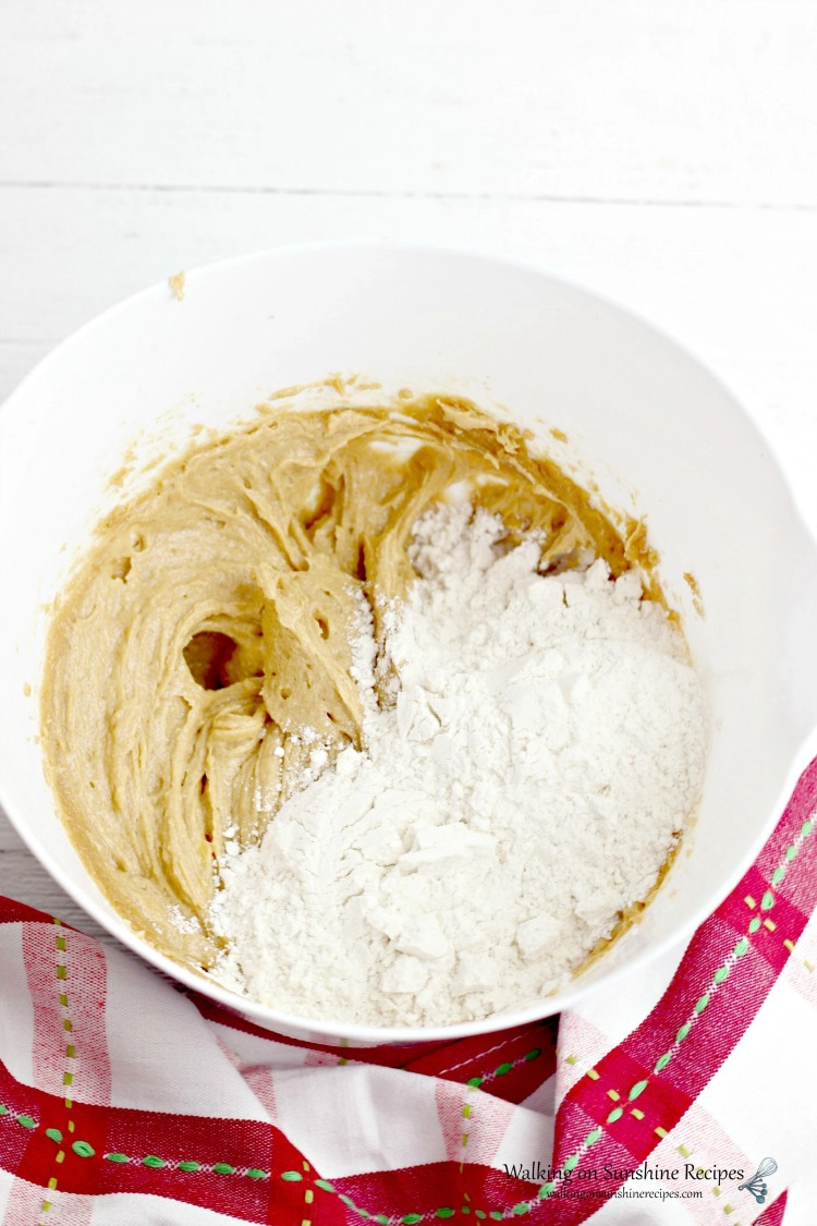 Add flour to creamed butter mixture