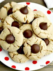 Peanut Butter Blossoms on white plate with red dots