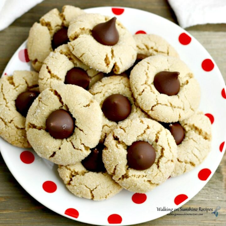 Peanut Butter Blossoms on white plate with red dots
