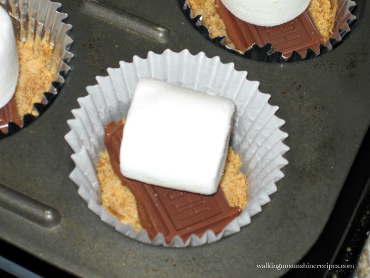 S'mores Cookie Cups: Easy, Delicious and Made in the Oven from Walking on Sunshine Recipes. Add the Marshmallow on top of the Chocolate for S'more's Cookie Cups from Walking on Sunshine Recipes