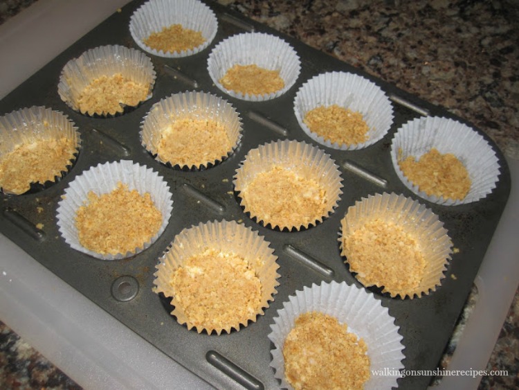 Press the Graham Cracker Crumbs into the Bottom of a Cupcake Liner 
