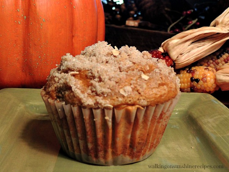Pumpkin Muffins have just the right amount of pumpkin spice and chocolate chips. They're super moist with a yummy crumb topping from Walking on Sunshine Recipes. Pumpkin Muffin with Crumb Topping on Green Plate