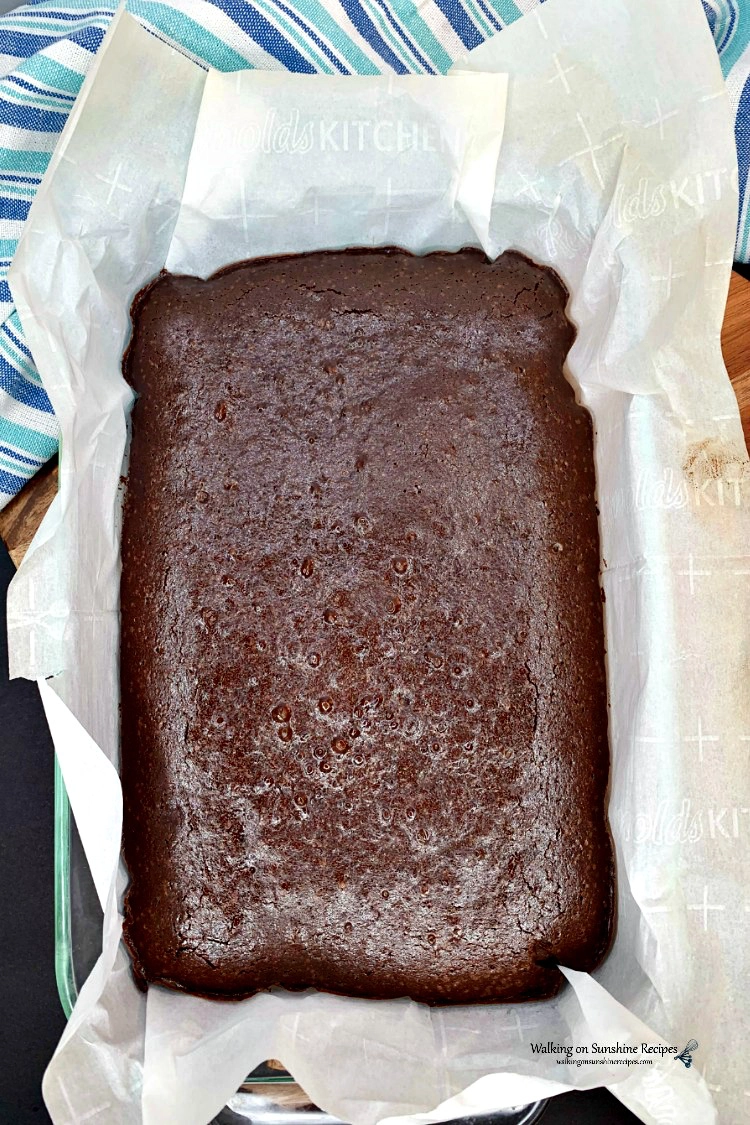 Homemade Brownies with Coffee in the Batter Baked in pan with parchment paper.