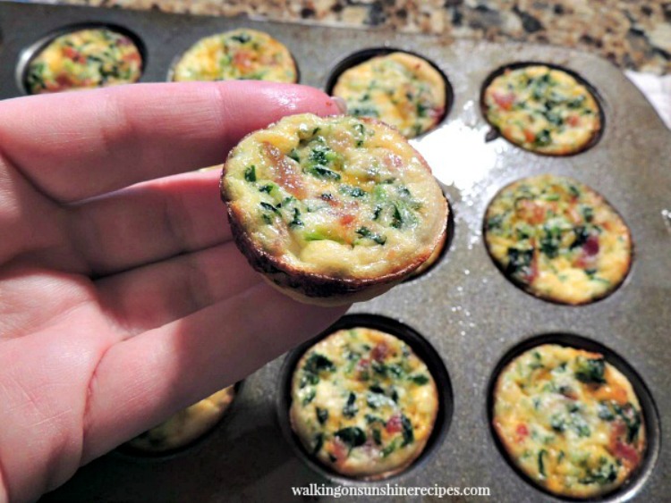 Mini Quiche made with chopped spinach, bacon and cheddar cheese.