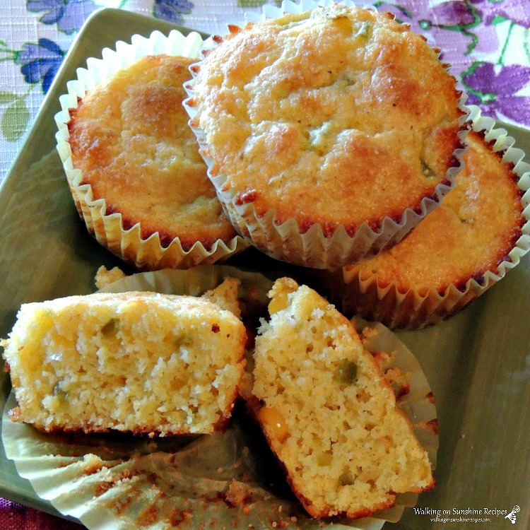 Jalapeno Corn Muffins sliced open an on green plate. 