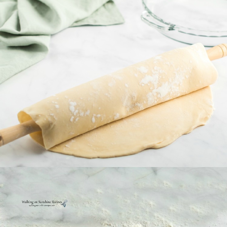 roll pie dough over rolling pin for easy transfer