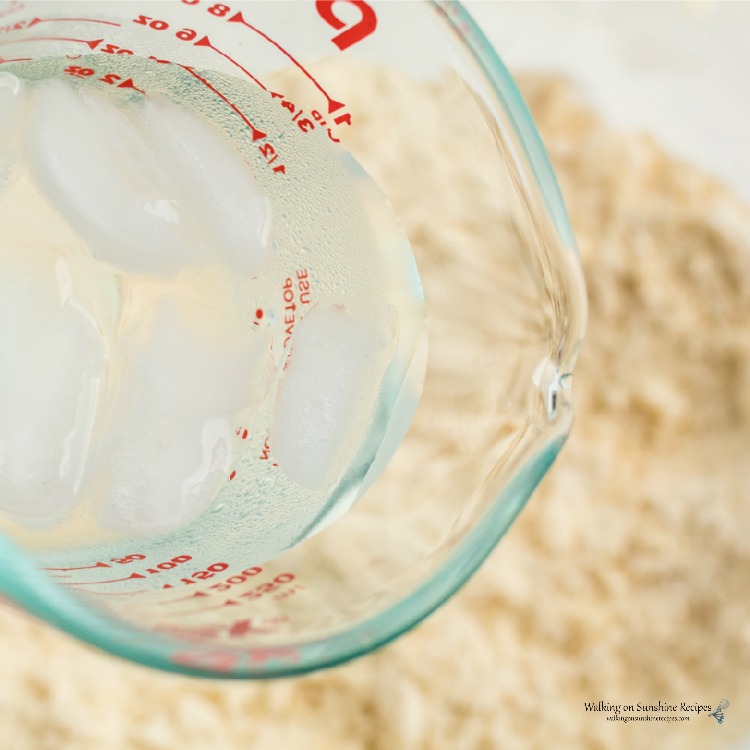 Slowly incorporate ice water into the flour shortening mixture for Pie Crust Basics