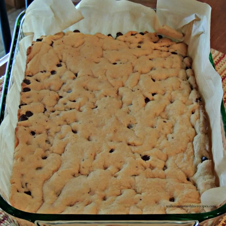 how to use a cookie cutter on chocolate chip cookies while in baking pan lined with parchment paper. 