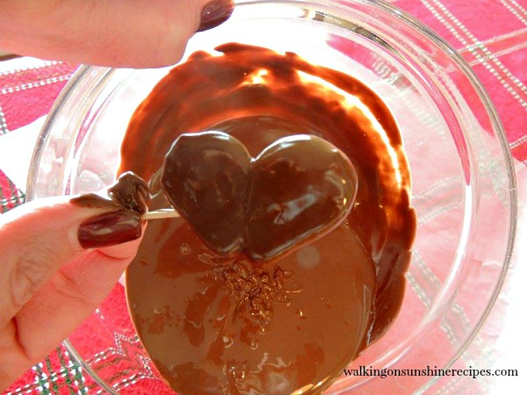 Strawberry hearts dipped in melted chocolate. 