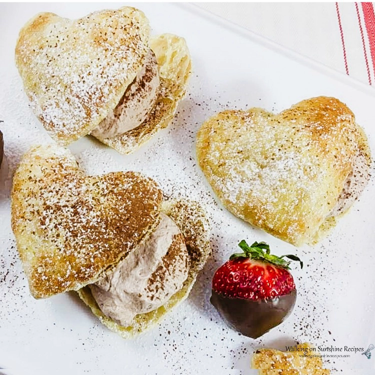 Puff pastry cut into heart shapes filled with chocolate mousse. 