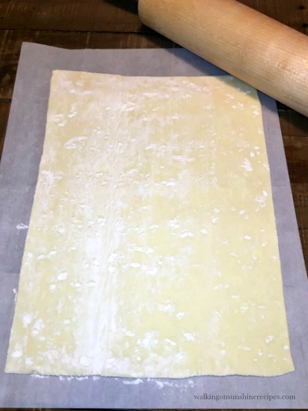 Puff pastry sheet on top of parchment paper. 