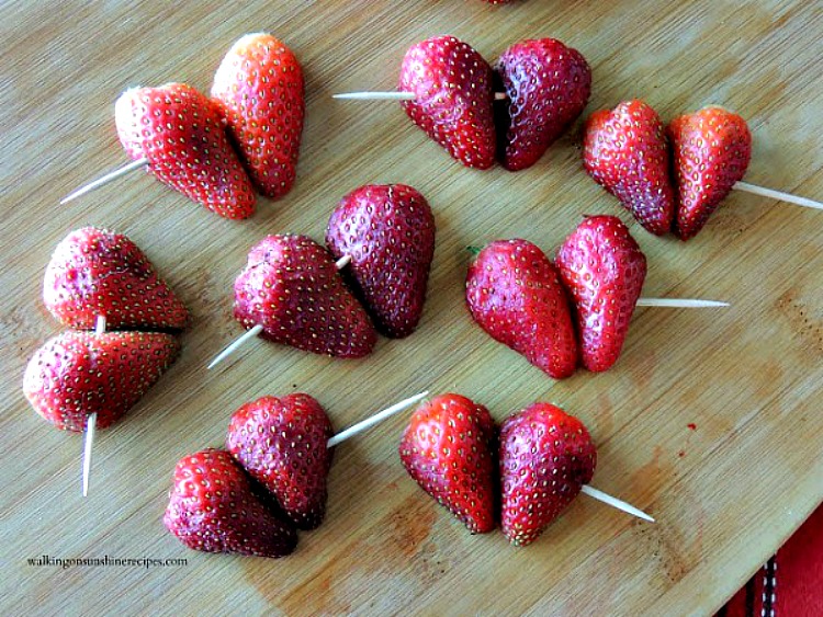 heart strawberry held together with toothpicks. 