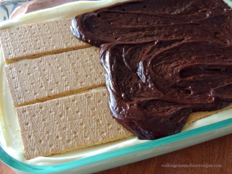 Spread Melted Chocolate on top of Graham Crackers for Chocolate Eclair Pudding Pie 