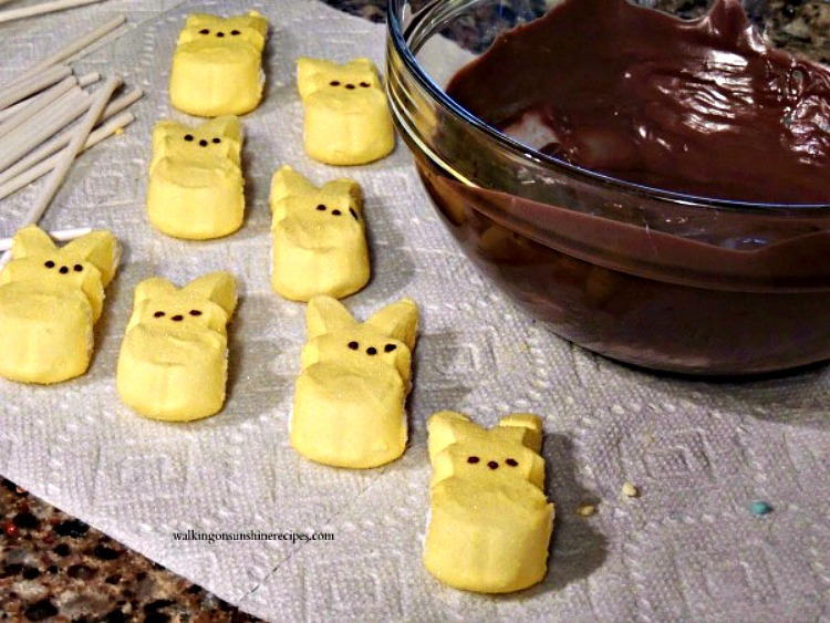 Chocolate Covered Peeps are a fun and easy treat to make this Spring and especially for Easter that kids of all ages are going to love from Walking on Sunshine Recipes. Yellow Marshmallow Bunny Peeps and bowl of chocolate