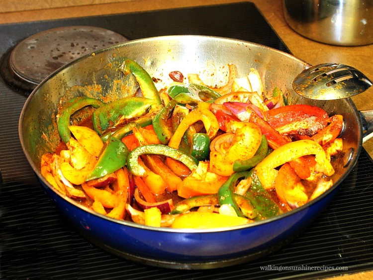 Onions and Peppers cooked in frying pan