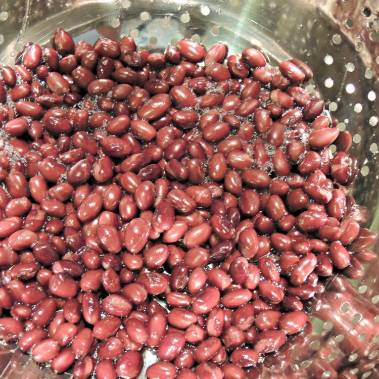 red kidney beans in colander draining.