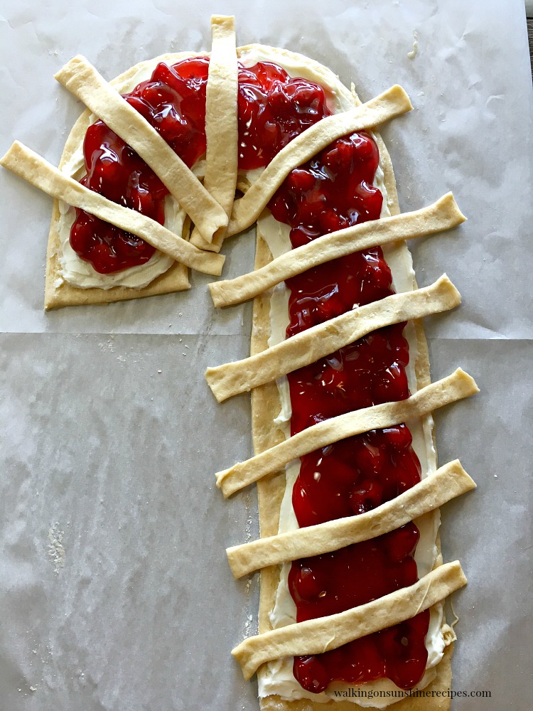 Candy Cane Cream Cheese Danish Lay the extra dough on top of the danish to create the stripes of the candy cane from Walking on Sunshine Recipes.