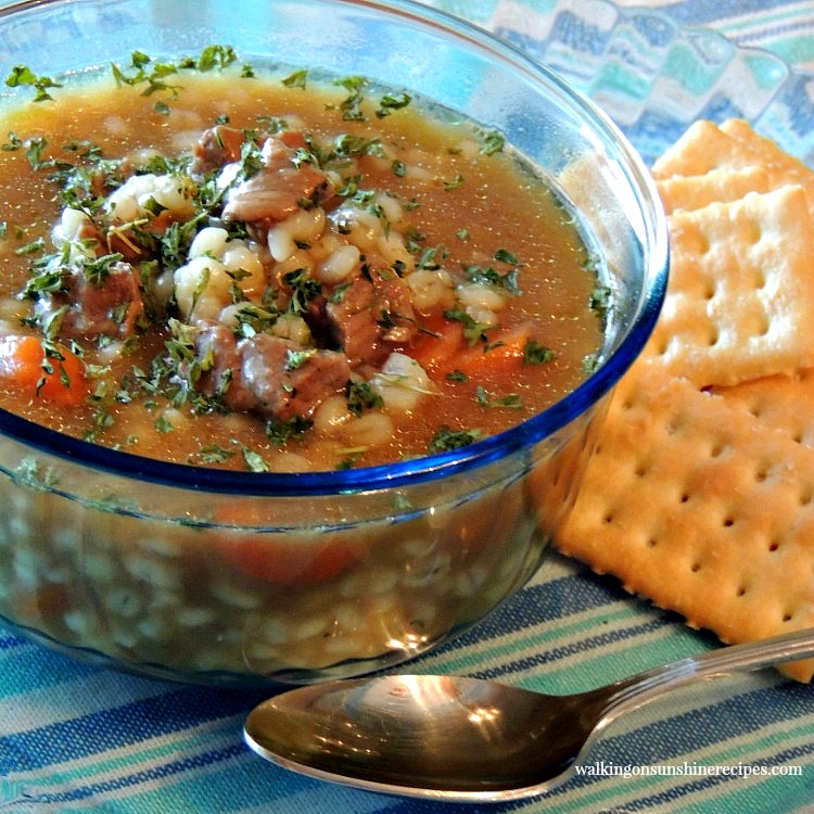 Beef Barley Soup in bowl with crackers from Walking on Sunshine Recipes.