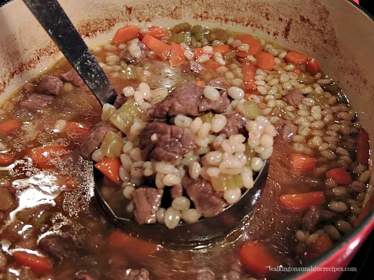 Beef Barley Soup in pot from Walking on Sunshine Recipes.