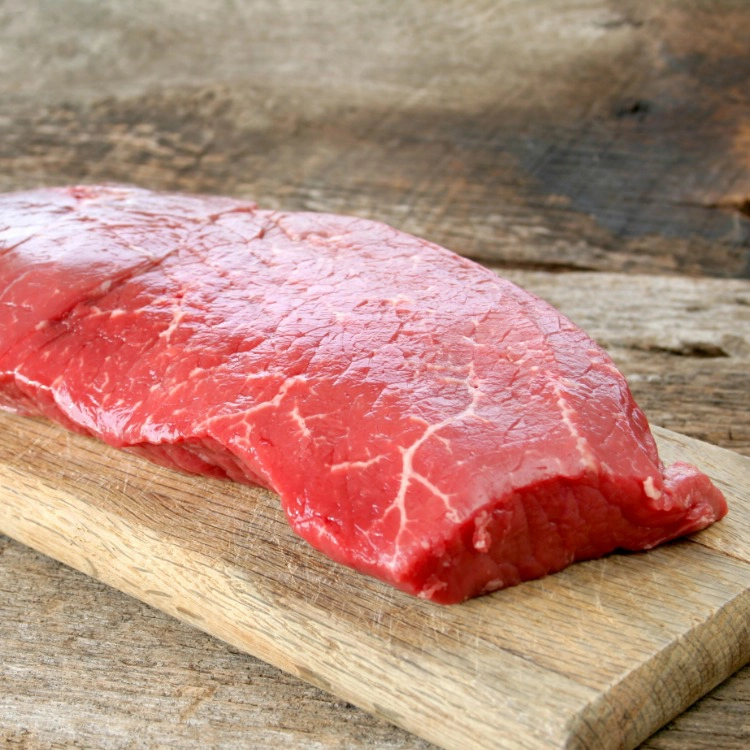 Raw London Broil on Wooden Cutting Board