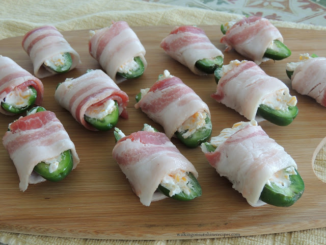 wrapped uncooked bacon around each jalapeno pepper stuffed with cream cheese mixture