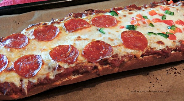 French Bread Pizza on baking tray ready to enjoy for dinner from Walking on Sunshine