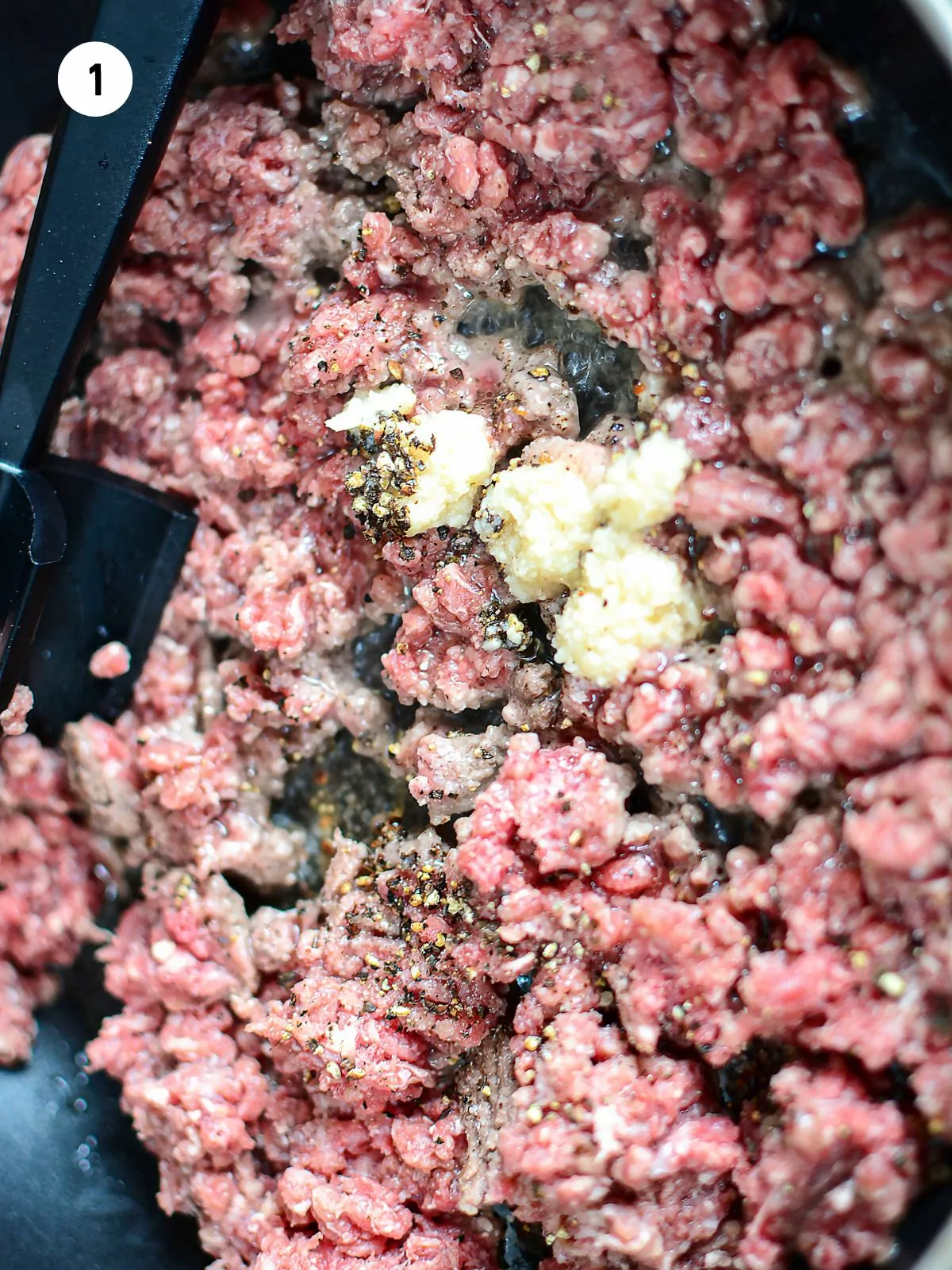 brown ground beef, garlic, salt and pepper over medium heat
