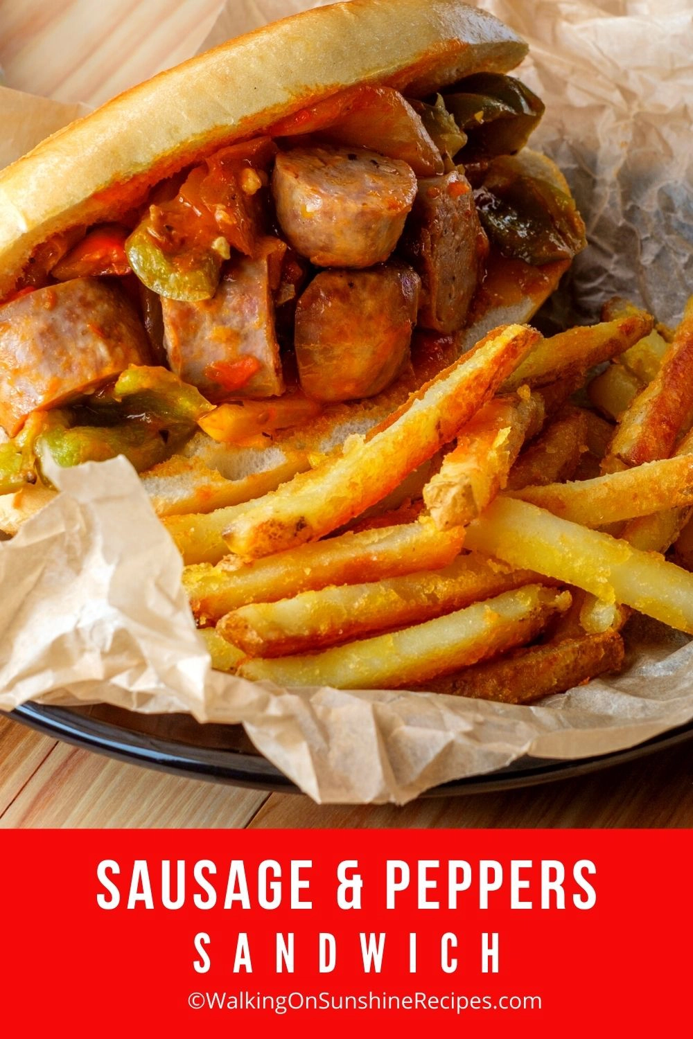 Sausage and Peppers Sandwich with French Fries. 