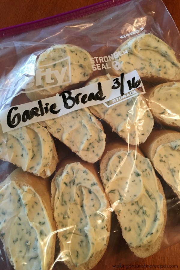 garlic butter on French bread slices in freezer-safe plastic bags. 