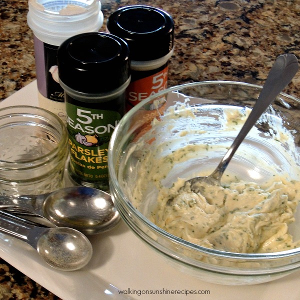 garlic spread in mixing bowl with spoons. 