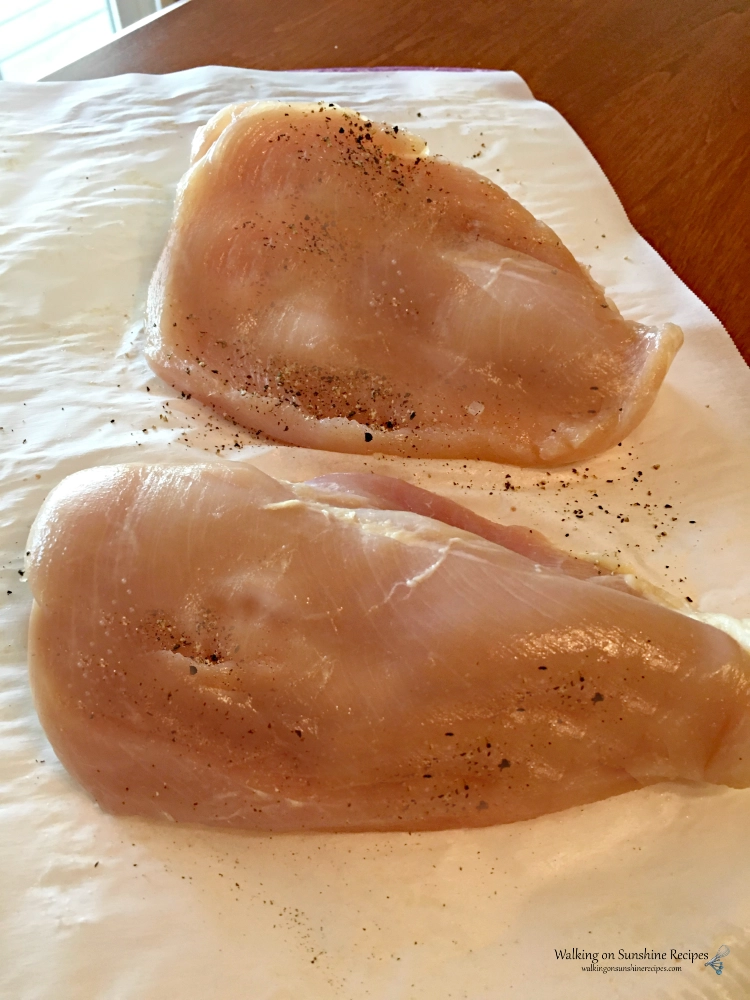 chicken breasts on parchment paper. 