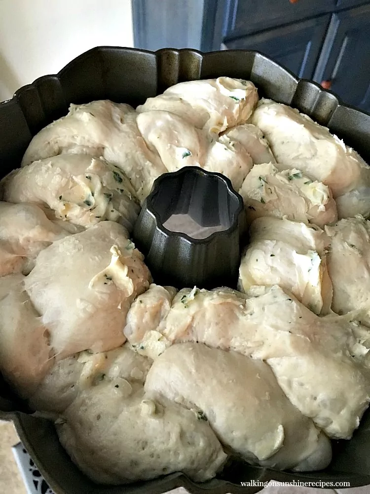 Garlic Parmesan Pull Apart Monkey Bread Biscuits doubled in size in bundt pan ready to bake. 