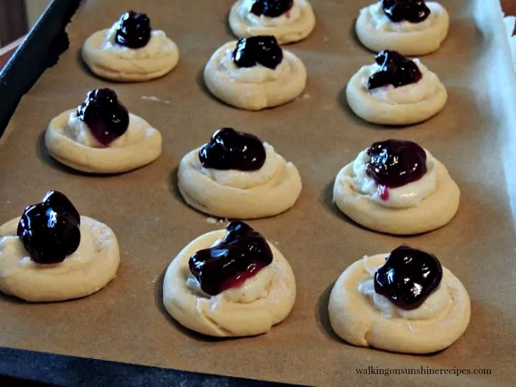 Place spoonful of blueberry pie filling on top of cream cheese mixture for Crescent Roll Danish