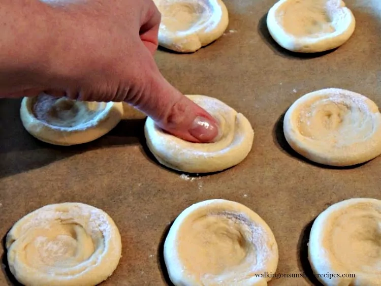 Press down on the crescent roll dough using your thumb from Walking on Sunshine Recipes