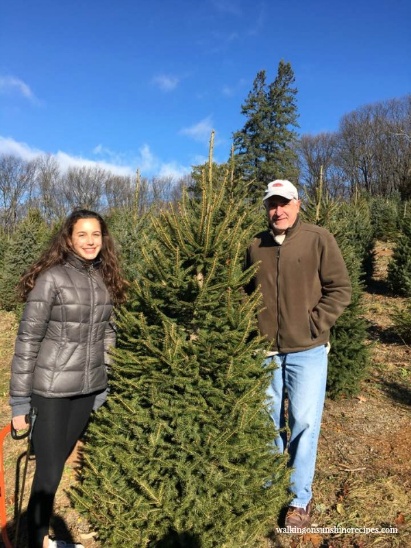 My brother and niece Gracie with the Christmas tree they picked out from Walking on Sunshine. 