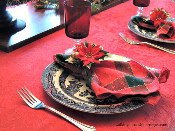 Blue Willow Plates and Red Stemware Glasses and How to Set a Festive Table for Christmas on a Budget from Walking on Sunshine. 