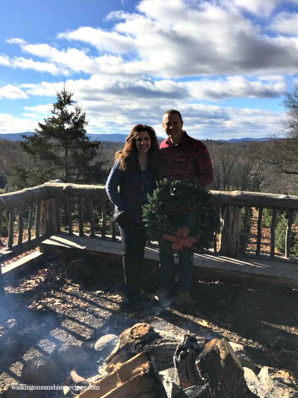 My hubby and I by the bonfire after cutting down our Christmas tree from Walking on Sunshine.