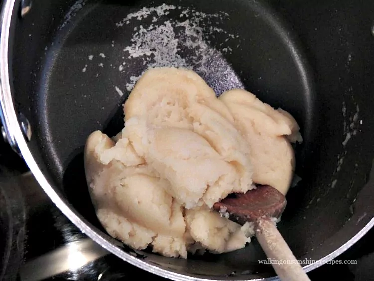 Cream Puff mixture forming a ball and pulling away from the sides of the pan from Walking on Sunshine