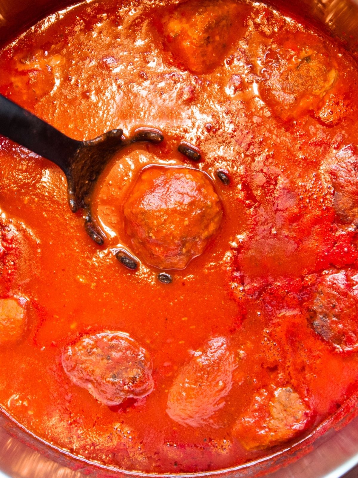 Add meatballs to slow cooker with sauce.