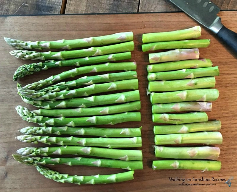 Preparing Asparagus by trimming the ends 
