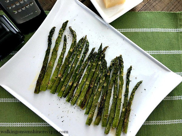 Roasted Asparagus on white tray before Parmesan Cheese from Walking on Sunshine