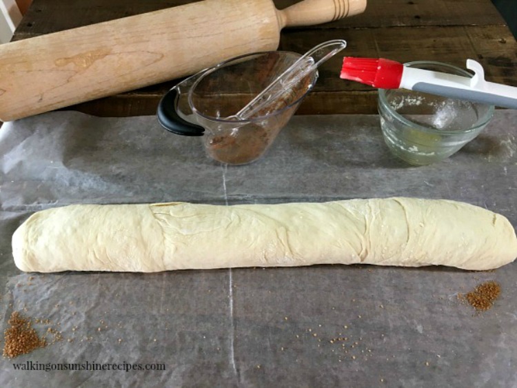 Frozen bread dough filled with cinnamon, sugar, butter rolled up and ready to slice. 