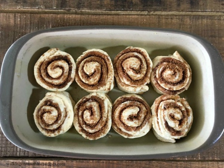 Frozen bread dough thawed and rolled with cinnamon sugar and butter in pan ready to rise from Walking on Sunshine