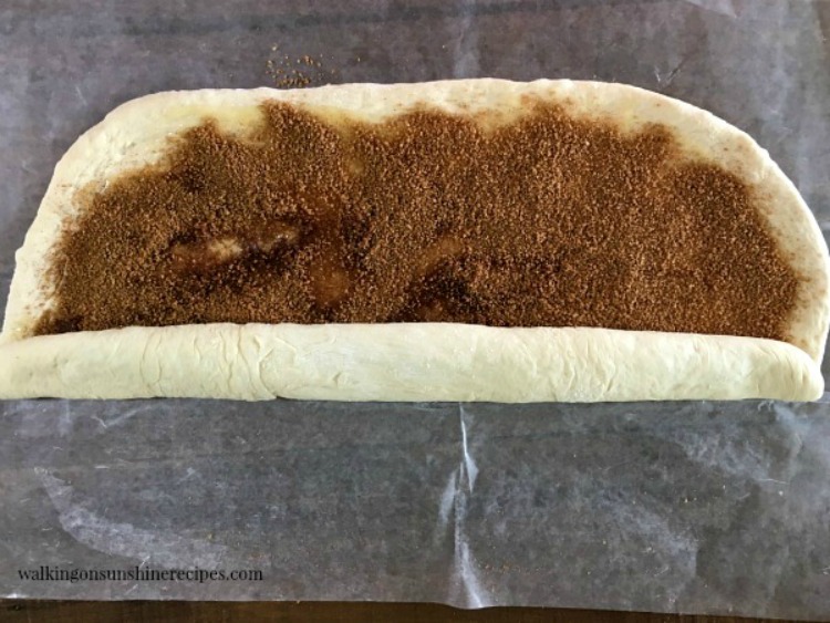 Starting at one end roll the thawed frozen bread dough into a cylinder shape. 