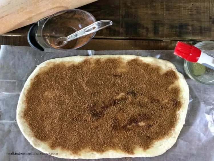 Spread brown sugar cinnamon mixture over dough using a pastry brush. 