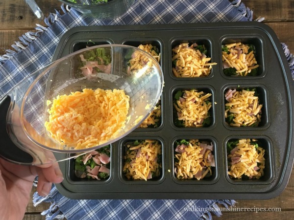 Add shredded cheese to the Scrambled Egg Muffins from Walking on Sunshine