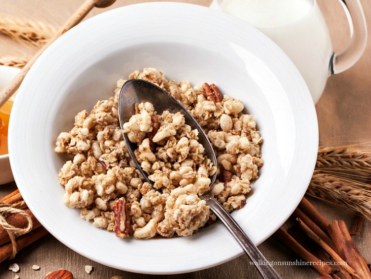 Granola in a bowl with spoon from Walking on Sunshine Recipes