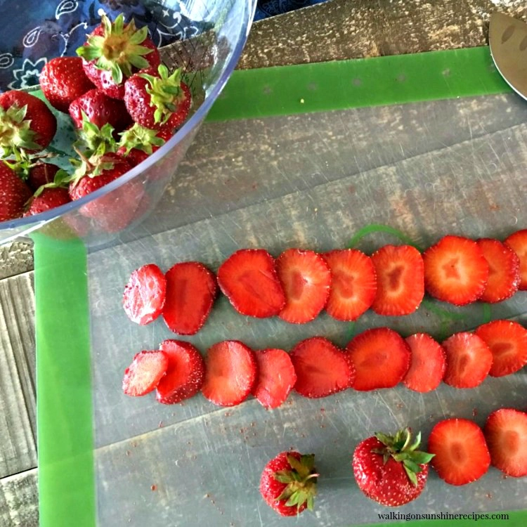 Slice Strawberries on cutting mat 